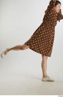 Aera  1 brown dots dress casual dressed flexing leg…